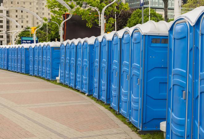 a row of portable restrooms at a fairground, offering visitors a clean and hassle-free experience in Davie, FL